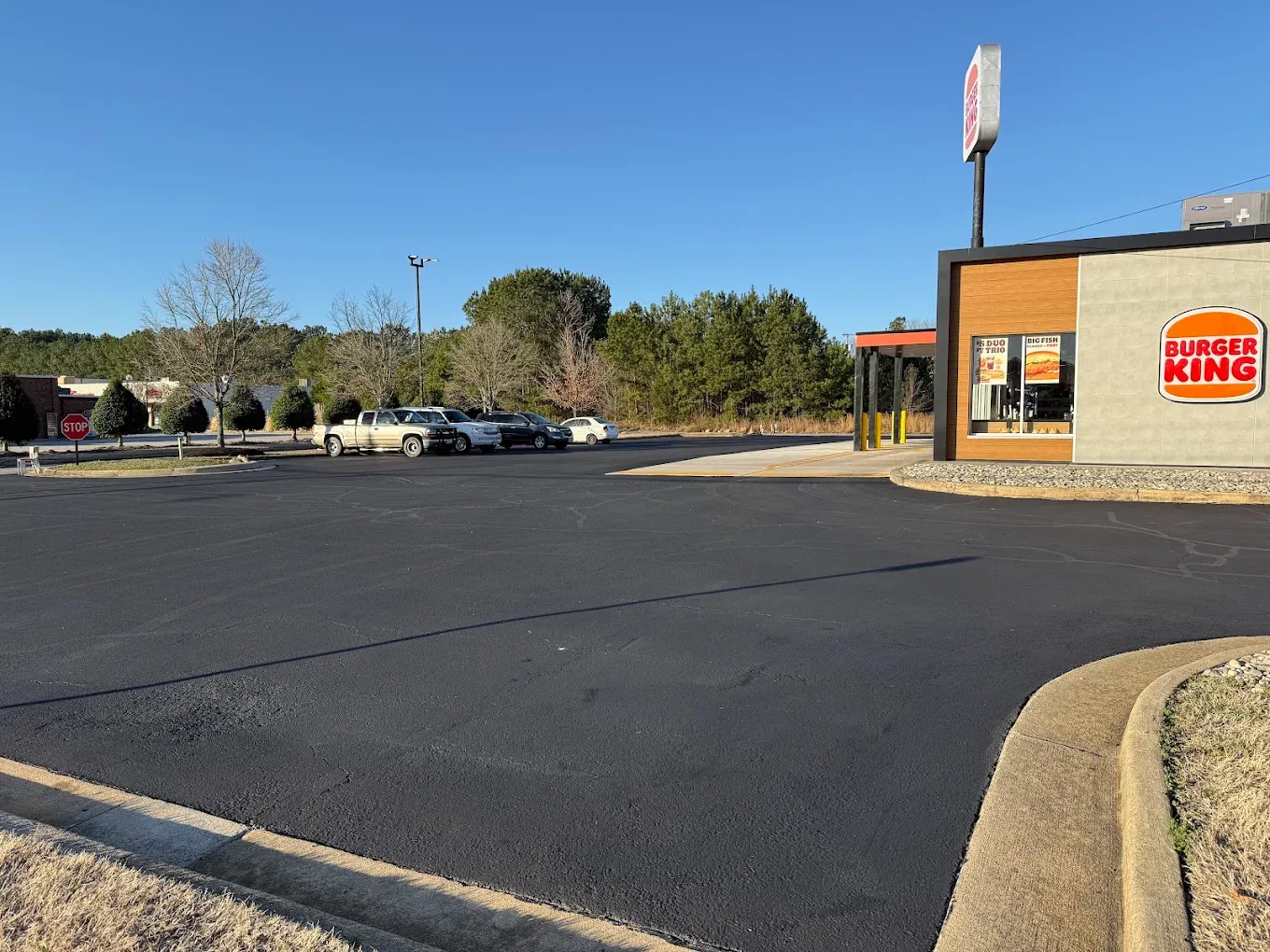 New asphalt surface around a restaurant parking area
